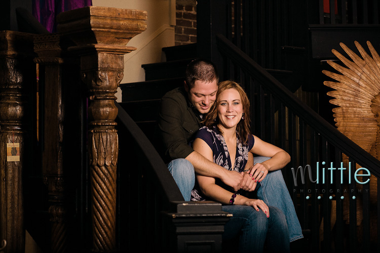 Couple embracing on vintage staircase