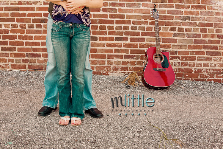 Couple jeans guitar brick wall photo
