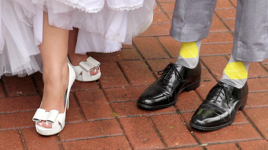 Wedding shoes and socks on brick path