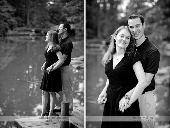 Couple embraces by lake in black and white photo