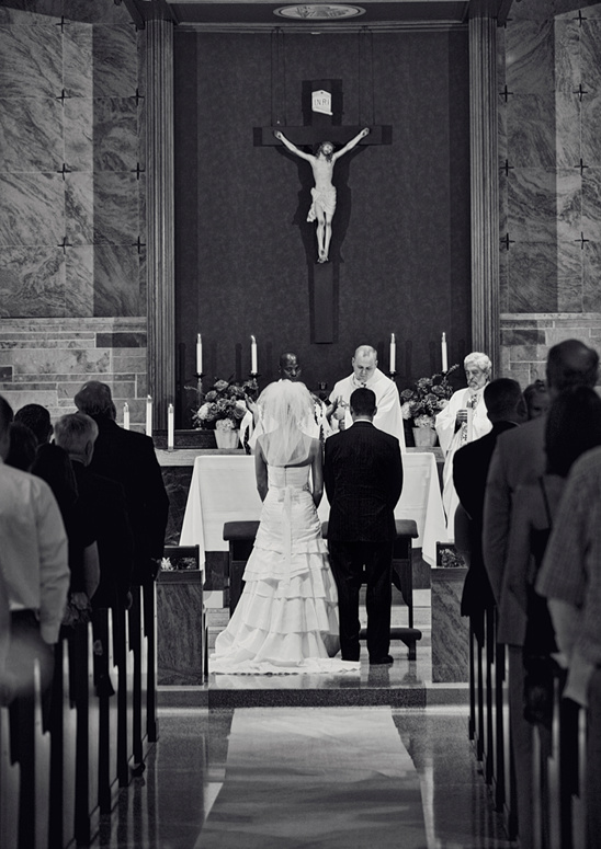 Wedding couple exchanging vows in church