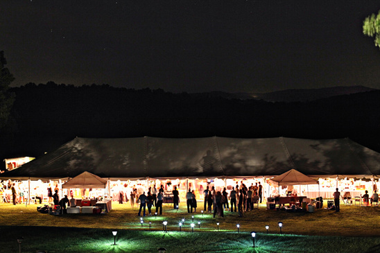 Nighttime event under illuminated tent