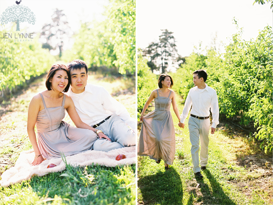 Couple in a light gray dress and white shirt in apple orchard