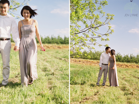 Couple walking and kissing in a field