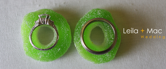 Leila and Mac wedding rings on green candy