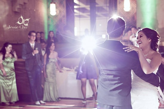 Happy bride and groom dancing at wedding reception
