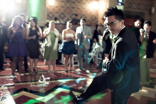 Groom joyfully dances at wedding reception