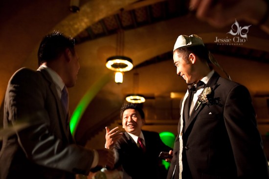 Groom and guests at wedding reception