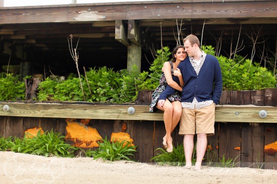 Couple cuddling on wooden pier