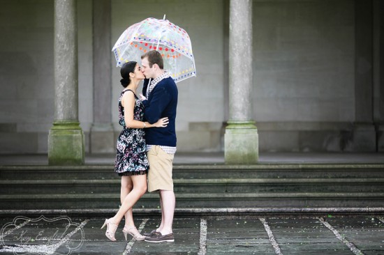 Couple kissing under umbrella
