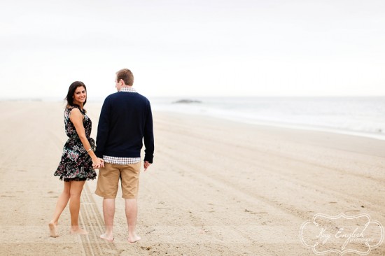 Couple walking hand in hand beach
