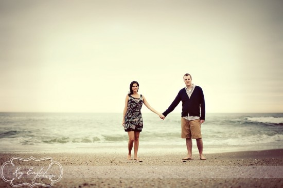 Couple holding hands on beach