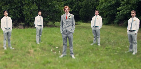 Groom's men in gray suits outdoors
