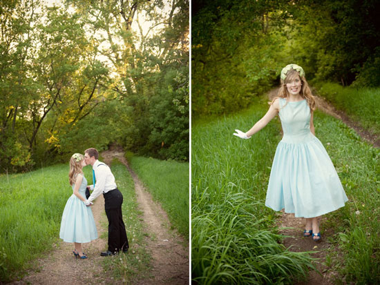 Couple kissing on path in the woods, woman in blue dress