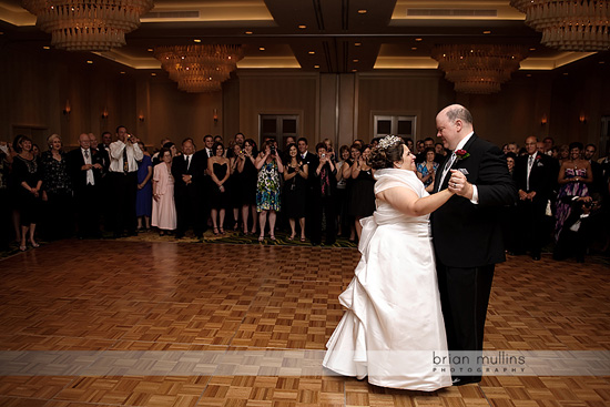 Bride and groom share a romantic first dance at wedding reception