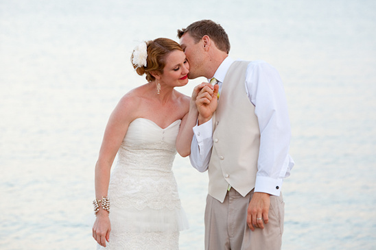 Bride and groom sharing a sweet kiss on their wedding day