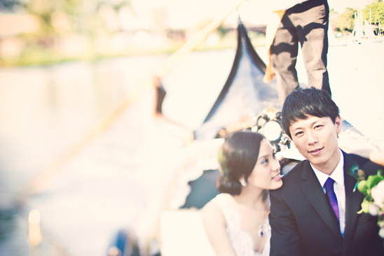 Bride and groom on gondola wedding portrait