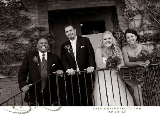 Wedding party posing on balcony