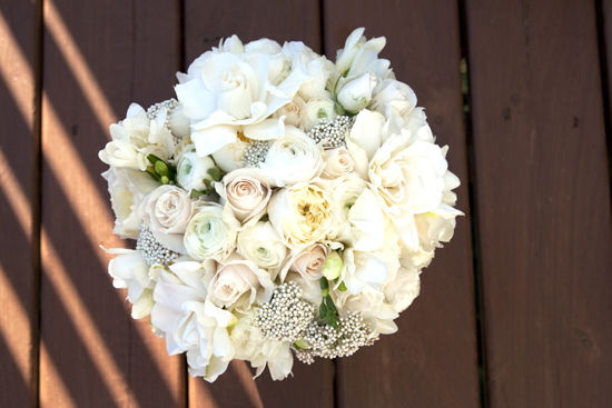 Elegant ivory wedding bouquet of roses and freesia