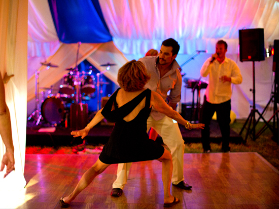 People dancing at a party with music
