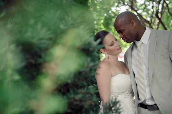 Interracial couple embrace on their wedding day