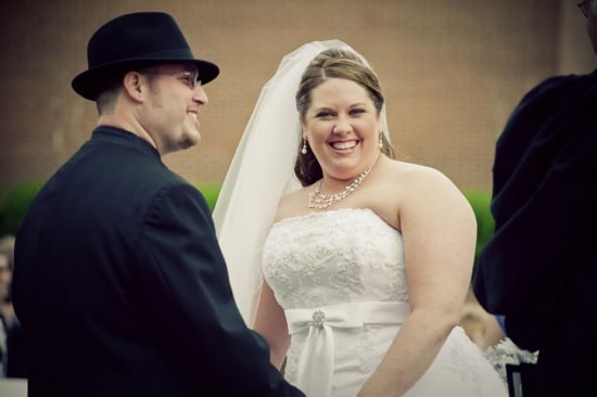 bride and groom smiling during outdoor wedding ceremony in grapevine, tx