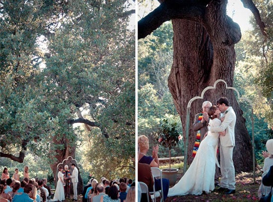 groom kisses his bride under an oak tree in austin tx