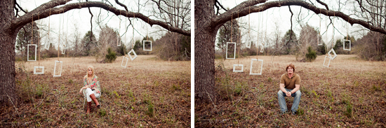 A couple sitting under a tree with frames hanging from branches