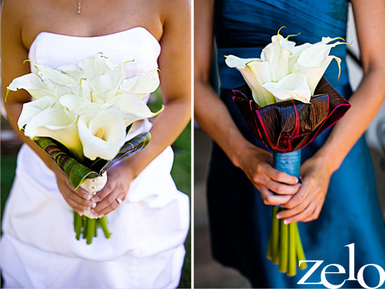 Bride and bridesmaid holding elegant white calla lily bouquets