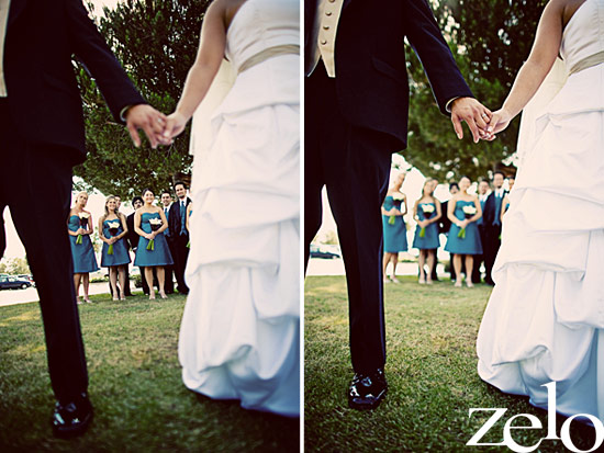 Wedding couple holding hands with bridal party behind them