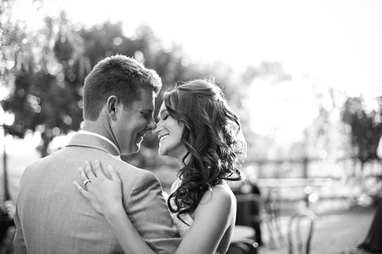 Romantic couple embracing outdoors, black and white