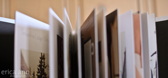 A photo book with open pages and art photography inside