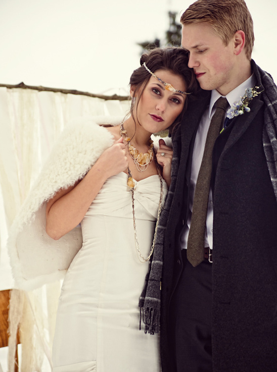 Winter wedding couple embracing, beautiful bride and groom