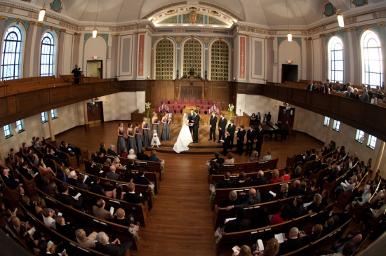 Wedding ceremony inside a beautiful church with many guests present
