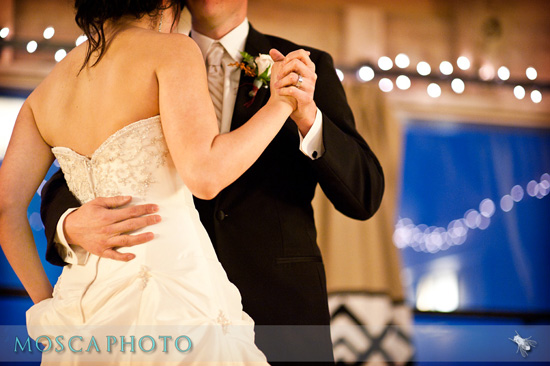 Bride and groom dancing the first dance at their wedding reception