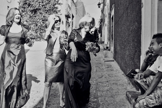 Elegant ladies walking down a street black and white