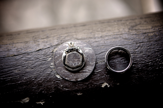 Wedding rings on rustic wood background