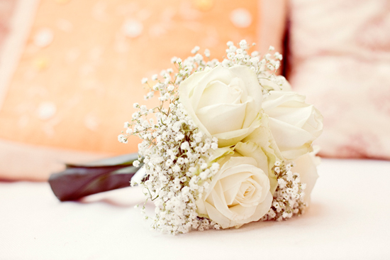 Beautiful white rose and baby's breath wedding bouquet