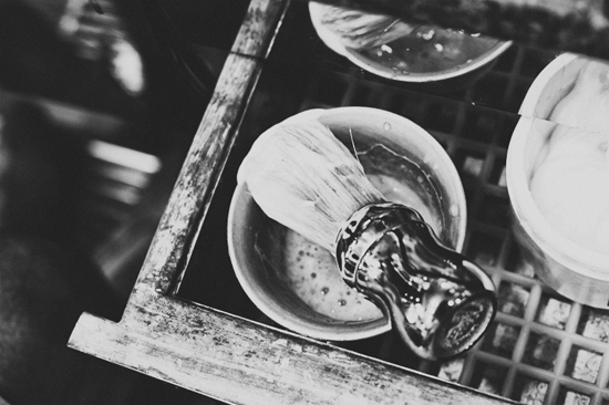 Black and white photo of barber shaving kit bowl brush