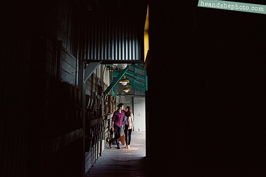 Couple walking down a dimly lit alleyway
