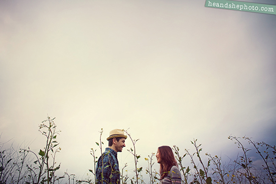 Romantic couple facing each other in a field