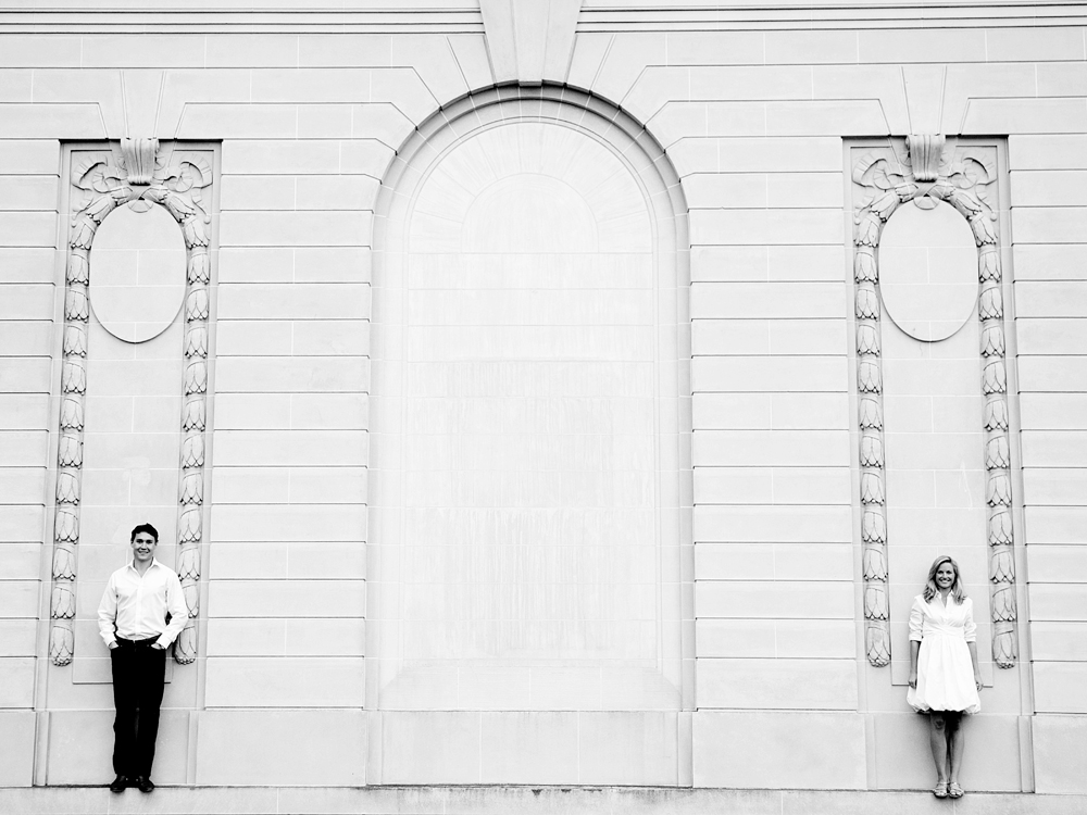 Ornate white building facade with people