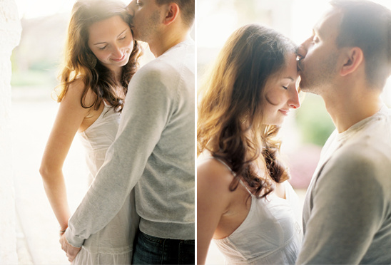 Romantic couple sharing a tender moment with a gentle forehead kiss