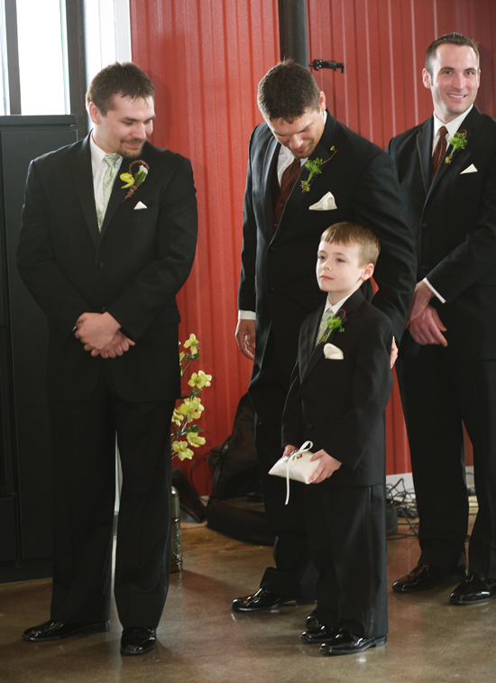 Groomsmen and ring bearer in tuxedos at wedding