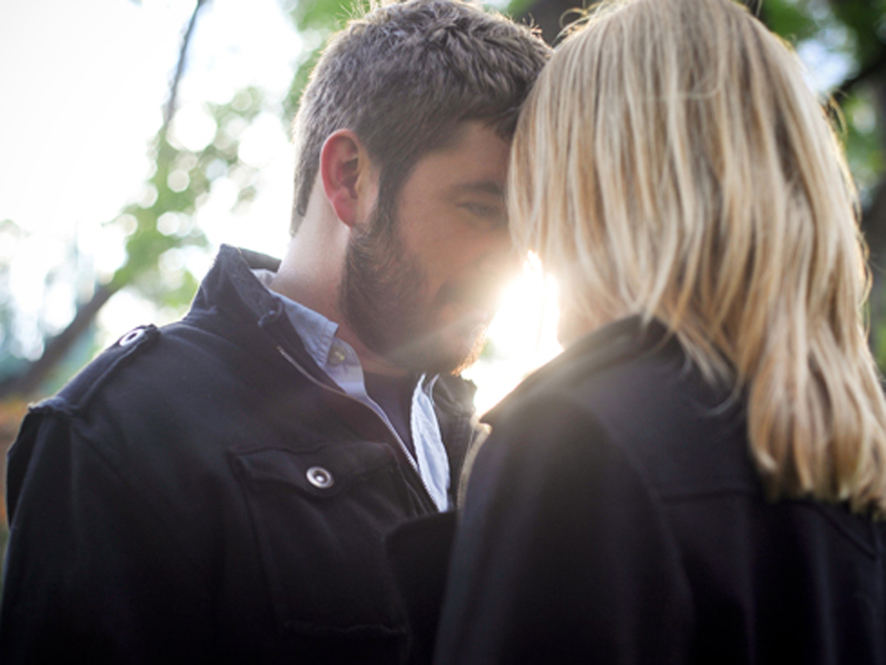 Couple sharing a tender moment outdoors