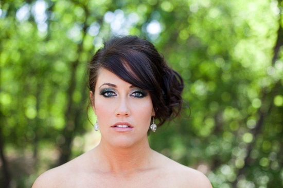 Beautiful bride with teal eye makeup and elegant hairstyle