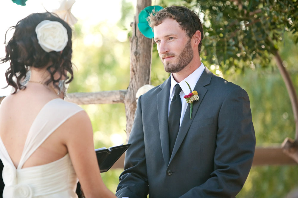 Groom in suit at wedding ceremony