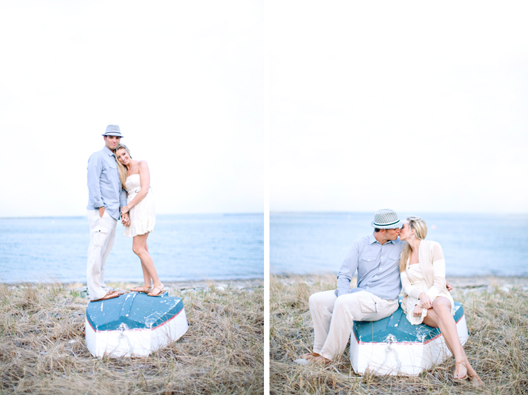Couple on boat kissing near the beach engagement photos