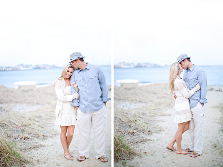 Couple kissing on beach engagement photo shoot