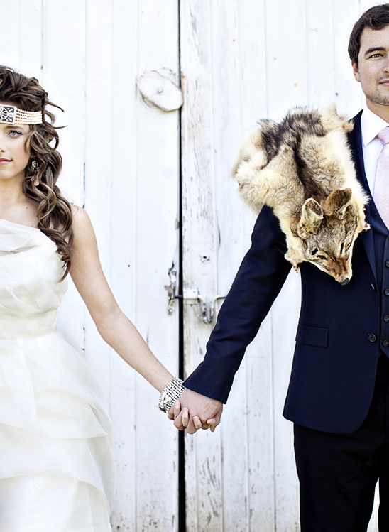 Bride and groom holding hands, rustic wedding